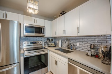 Recently renovated modern condo with new kitchen cabinets on Hillsboro Pines Golf in Florida - for sale on GolfHomes.com, golf home, golf lot