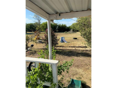 Golf Course Road Cottage- This home on 1.49 acres has just on San Saba River Golf Course in Texas - for sale on GolfHomes.com, golf home, golf lot