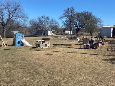 Golf Course Road Cottage- This home on 1.49 acres has just on San Saba River Golf Course in Texas - for sale on GolfHomes.com, golf home, golf lot