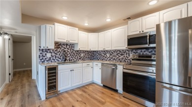 Check out this beautiful home located in a peaceful no wake cove on Seasons Ridge At Four Seasons in Missouri - for sale on GolfHomes.com, golf home, golf lot