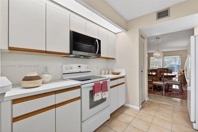 Best priced, largest golf course facing 2/2 condo in Century on  in Florida - for sale on GolfHomes.com, golf home, golf lot