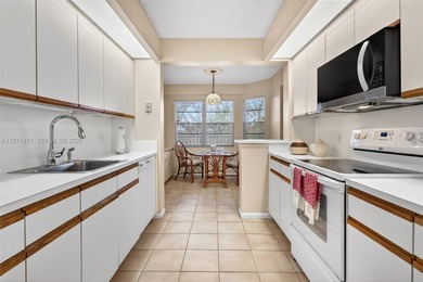 Best priced, largest golf course facing 2/2 condo in Century on  in Florida - for sale on GolfHomes.com, golf home, golf lot