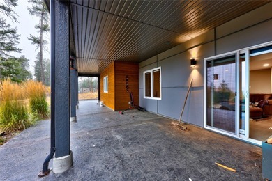 Welcome to this stunning contemporary walk-out rancher nestled on  in  - for sale on GolfHomes.com, golf home, golf lot