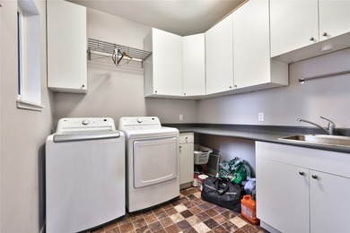 Welcome to this stunning contemporary walk-out rancher nestled on  in  - for sale on GolfHomes.com, golf home, golf lot