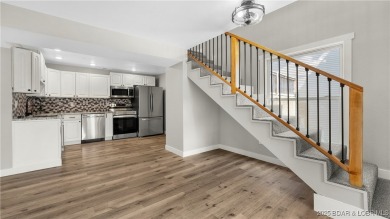Check out this beautiful home located in a peaceful no wake cove on Seasons Ridge At Four Seasons in Missouri - for sale on GolfHomes.com, golf home, golf lot