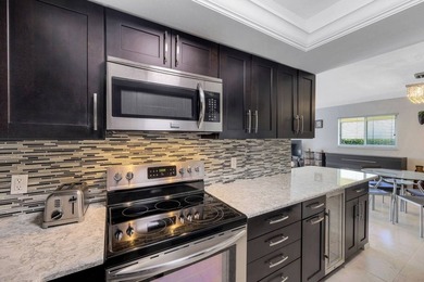 Discover this charming 2-bed, 2-bath villa in the Bundled Golf on The Glades Golf and Country Club in Florida - for sale on GolfHomes.com, golf home, golf lot