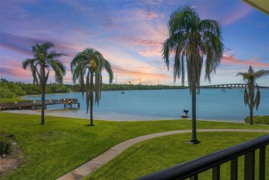 Beautiful water views abound from this 2nd floor villa in the on Isla Del Sol Yacht and Country Club in Florida - for sale on GolfHomes.com, golf home, golf lot