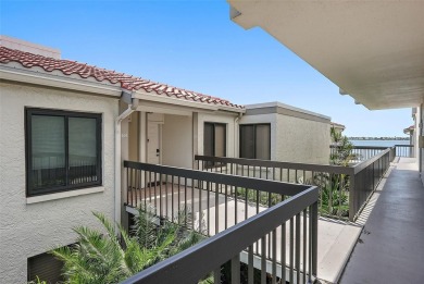 Beautiful water views abound from this 2nd floor villa in the on Isla Del Sol Yacht and Country Club in Florida - for sale on GolfHomes.com, golf home, golf lot