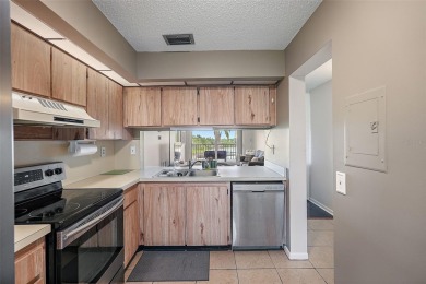 Beautiful water views abound from this 2nd floor villa in the on Isla Del Sol Yacht and Country Club in Florida - for sale on GolfHomes.com, golf home, golf lot
