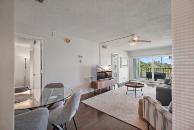 Beautiful water views abound from this 2nd floor villa in the on Isla Del Sol Yacht and Country Club in Florida - for sale on GolfHomes.com, golf home, golf lot