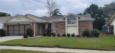 Beacon Woods East Pool Home . Huge Glass inclosed patio , Pool on Beacon Woods Golf Club in Florida - for sale on GolfHomes.com, golf home, golf lot