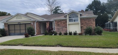 Beacon Woods East Pool Home . Huge Glass inclosed patio , Pool on Beacon Woods Golf Club in Florida - for sale on GolfHomes.com, golf home, golf lot