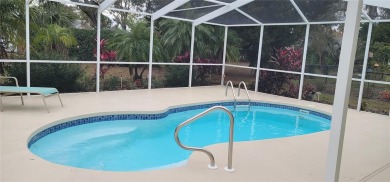 Beacon Woods East Pool Home . Huge Glass inclosed patio , Pool on Beacon Woods Golf Club in Florida - for sale on GolfHomes.com, golf home, golf lot