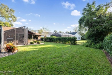 This beautiful brick home, nestled in the prestigious gated on Spruce Creek Golf Club in Florida - for sale on GolfHomes.com, golf home, golf lot