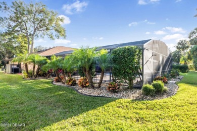 This beautiful brick home, nestled in the prestigious gated on Spruce Creek Golf Club in Florida - for sale on GolfHomes.com, golf home, golf lot