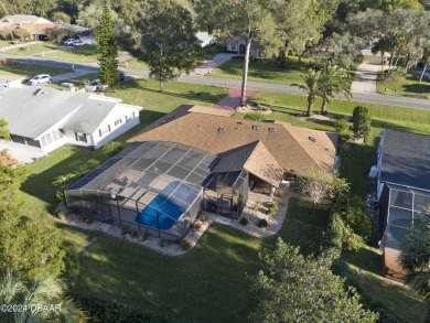 This beautiful brick home, nestled in the prestigious gated on Spruce Creek Golf Club in Florida - for sale on GolfHomes.com, golf home, golf lot