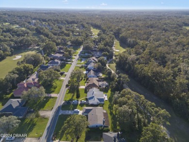 This beautiful brick home, nestled in the prestigious gated on Spruce Creek Golf Club in Florida - for sale on GolfHomes.com, golf home, golf lot