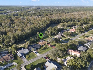 This beautiful brick home, nestled in the prestigious gated on Spruce Creek Golf Club in Florida - for sale on GolfHomes.com, golf home, golf lot