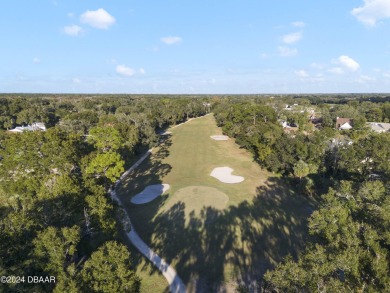 This beautiful brick home, nestled in the prestigious gated on Spruce Creek Golf Club in Florida - for sale on GolfHomes.com, golf home, golf lot