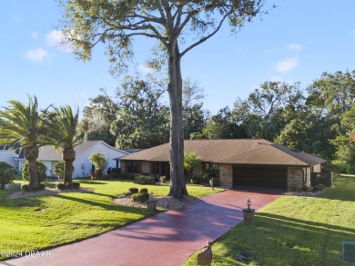 This beautiful brick home, nestled in the prestigious gated on Spruce Creek Golf Club in Florida - for sale on GolfHomes.com, golf home, golf lot