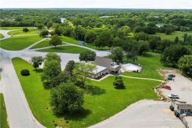Nice weekend home on 3 LOTS (649, 650, and 651) on popular Buck on Linn Valley Lakes - Deer Trace Golf Course in Kansas - for sale on GolfHomes.com, golf home, golf lot