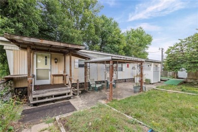 Nice weekend home on 3 LOTS (649, 650, and 651) on popular Buck on Linn Valley Lakes - Deer Trace Golf Course in Kansas - for sale on GolfHomes.com, golf home, golf lot