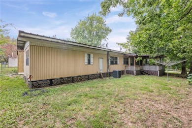 Nice weekend home on 3 LOTS (649, 650, and 651) on popular Buck on Linn Valley Lakes - Deer Trace Golf Course in Kansas - for sale on GolfHomes.com, golf home, golf lot