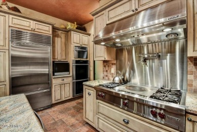 Experience luxury and ease in this rare semi-custom villa on Superstition Mountain Club - Lost Gold in Arizona - for sale on GolfHomes.com, golf home, golf lot