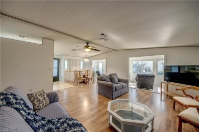 Remodeled with a new roof, new garage for golf cart, and a on Lake Fairways Country Club in Florida - for sale on GolfHomes.com, golf home, golf lot