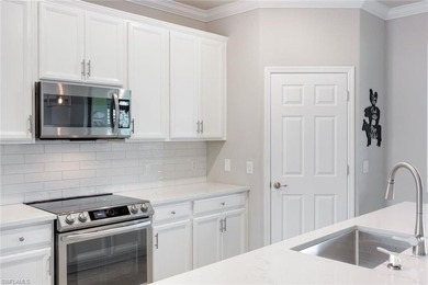 Welcome to this stunning coach home in the highly sought-after on Bonita National Golf Course in Florida - for sale on GolfHomes.com, golf home, golf lot