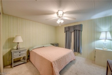 Remodeled with a new roof, new garage for golf cart, and a on Lake Fairways Country Club in Florida - for sale on GolfHomes.com, golf home, golf lot