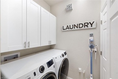 Welcome to this stunning coach home in the highly sought-after on Bonita National Golf Course in Florida - for sale on GolfHomes.com, golf home, golf lot