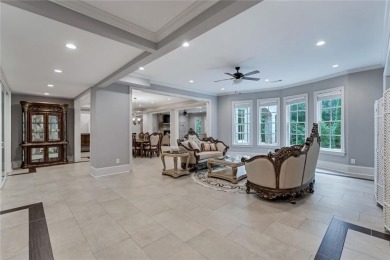 Positioned on a quiet cul-de-sac overlooking the 17th green on TPC At Sugarloaf Golf Club in Georgia - for sale on GolfHomes.com, golf home, golf lot