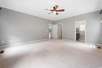 Welcome to this stunning 4-bedroom home nestled in the heart of on Wedgefield Plantation Golf Club in South Carolina - for sale on GolfHomes.com, golf home, golf lot