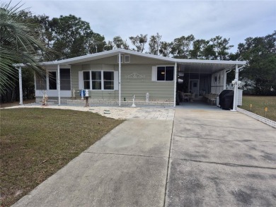 REDUCED PRICE. This home, built by Palm Harbor Homes is located on Brookridge Country Club in Florida - for sale on GolfHomes.com, golf home, golf lot