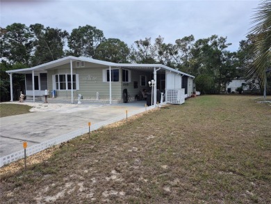 REDUCED PRICE. This home, built by Palm Harbor Homes is located on Brookridge Country Club in Florida - for sale on GolfHomes.com, golf home, golf lot