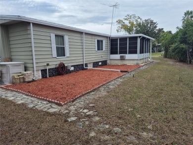 REDUCED PRICE. This home, built by Palm Harbor Homes is located on Brookridge Country Club in Florida - for sale on GolfHomes.com, golf home, golf lot