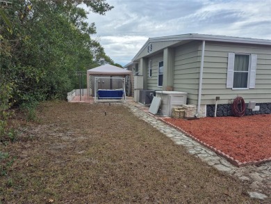 REDUCED PRICE. This home, built by Palm Harbor Homes is located on Brookridge Country Club in Florida - for sale on GolfHomes.com, golf home, golf lot