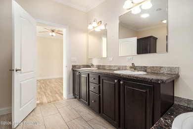 Nestled in the charming community of Barefoot Bay, this stunning on Barefoot Bay Golf Course in Florida - for sale on GolfHomes.com, golf home, golf lot