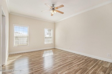 Nestled in the charming community of Barefoot Bay, this stunning on Barefoot Bay Golf Course in Florida - for sale on GolfHomes.com, golf home, golf lot