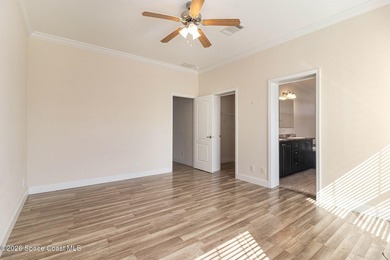 Nestled in the charming community of Barefoot Bay, this stunning on Barefoot Bay Golf Course in Florida - for sale on GolfHomes.com, golf home, golf lot