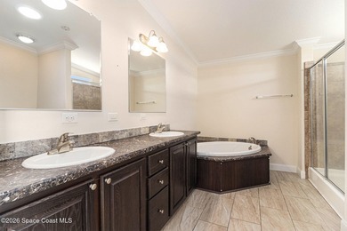 Nestled in the charming community of Barefoot Bay, this stunning on Barefoot Bay Golf Course in Florida - for sale on GolfHomes.com, golf home, golf lot