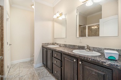 Nestled in the charming community of Barefoot Bay, this stunning on Barefoot Bay Golf Course in Florida - for sale on GolfHomes.com, golf home, golf lot