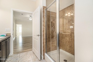 Nestled in the charming community of Barefoot Bay, this stunning on Barefoot Bay Golf Course in Florida - for sale on GolfHomes.com, golf home, golf lot