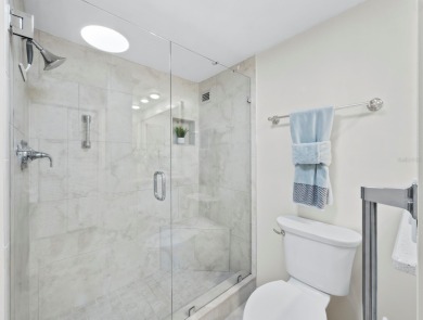 This inviting residence at the Islander Club of Longboat Key on Links on Longboat Golf Club in Florida - for sale on GolfHomes.com, golf home, golf lot