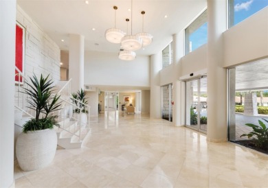 This inviting residence at the Islander Club of Longboat Key on Links on Longboat Golf Club in Florida - for sale on GolfHomes.com, golf home, golf lot