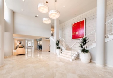 This inviting residence at the Islander Club of Longboat Key on Links on Longboat Golf Club in Florida - for sale on GolfHomes.com, golf home, golf lot