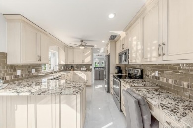 Shows like a model home! Completely remodeled with amazing on Monarch Country Club in Florida - for sale on GolfHomes.com, golf home, golf lot