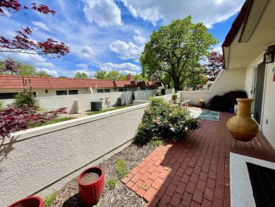 Welcome to 49 E Via Roma, a refined 2-bedroom, 3-bath townhome on Crestview Country Club in Kansas - for sale on GolfHomes.com, golf home, golf lot