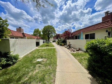 Welcome to 49 E Via Roma, a refined 2-bedroom, 3-bath townhome on Crestview Country Club in Kansas - for sale on GolfHomes.com, golf home, golf lot